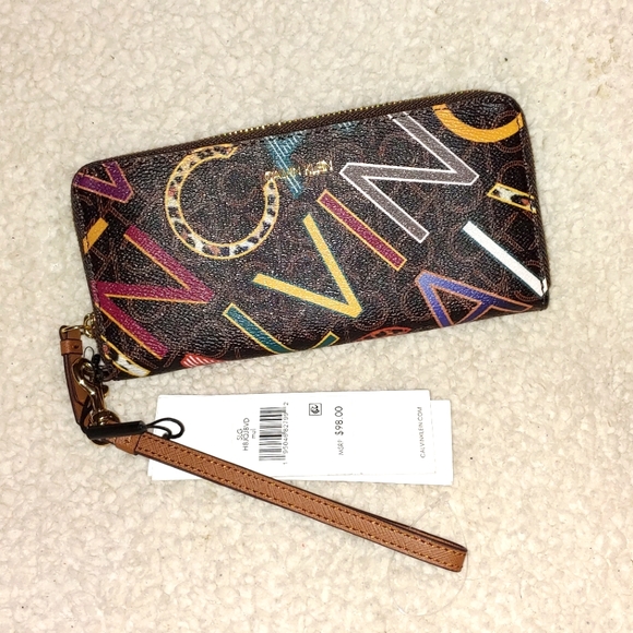 Calvin Klein Handbags - ✨BNWT Calvin Klein Monogram Continental Logo Zip Wallet